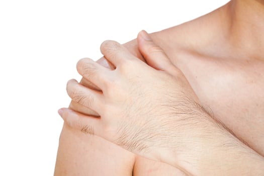 Young man suffering from shoulder pain on white background,Health care concept photo