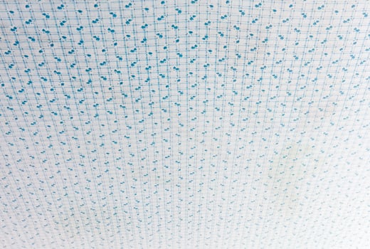 Dirty white net with the flowers pattern. photo