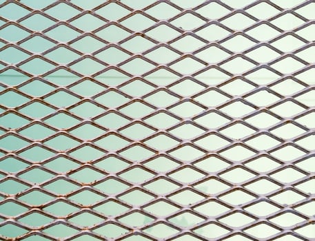 Metal mesh fence with the stain. photo