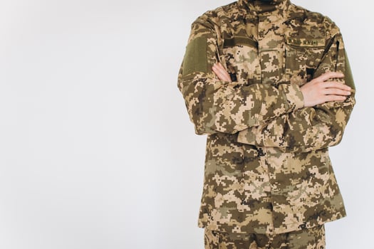 Portrait of a Ukrainian soldier in military uniform on a white background photo