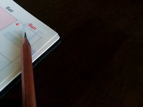 Pencil on the calendar planner. photo