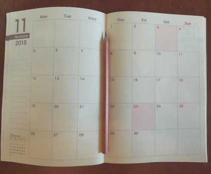 Pencil on the calendar planner. photo