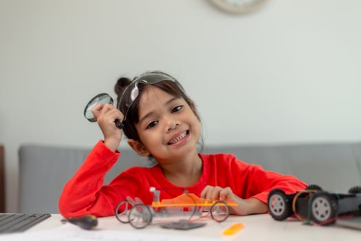 Asia students learn at home in coding robot cars and electronic board cables in STEM, STEAM, mathematics engineering science technology computer code in robotics for kids concept. photo