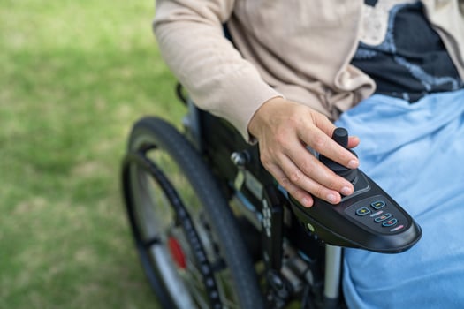 Asian lady woman patient on electric wheelchair with joystick and remote control at nursing hospital ward, healthy strong medical concept photo