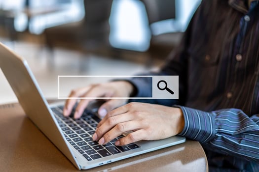Data Search Technology Search Engine Optimization. People hands using laptop or computer searching for information in internet online society web with search box icon at table indoors photo