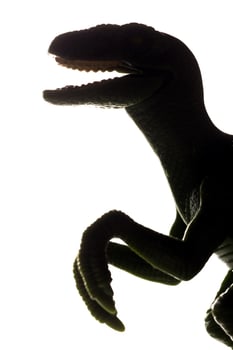 T-Rex dinosaur toy silhouette in back light. Tyrannosaurus Rex photo