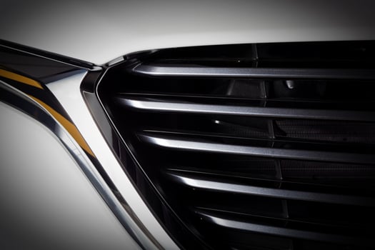 Modern luxury car close-up of grille. Expensive, sports auto detailing photo