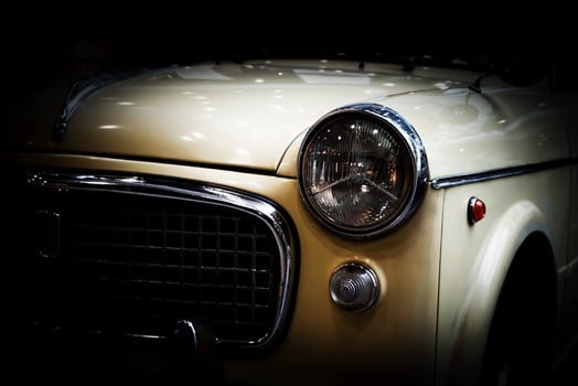 Retro classic car on black background. Vintage, elegant photo