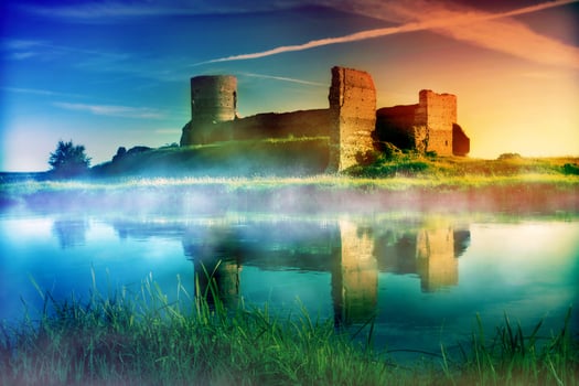 Old castle ruins at magical sunset photo