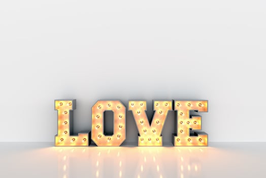 Love word with light bulbs inside on white clean wall background photo