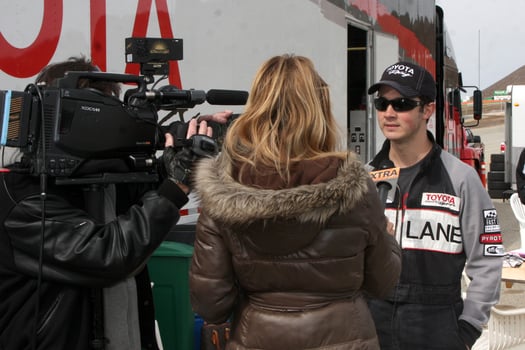 LOS ANGELES, MAR 19 - Extra Interviewing Kevin Jonas at the Toyota Pro Celebrity Race Training Session at Willow Springs Speedway on March 19, 2011 in Rosamond, CA photo