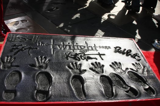 LOS ANGELES, NOV 3 - Robert Pattinson, Kristen Stewart, Taylor Lautner hand and foot prints at the Handprint and Footprint Ceremony for the Twilight Saga Actors at Grauman s Chinese Theater on November 3, 2011 in Los Angeles, CA photo