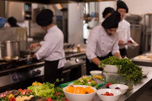 team cooks and chefs preparing meal photo