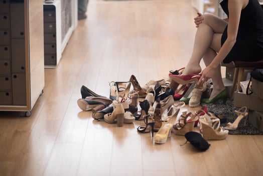 woman sitting in shoe store photo