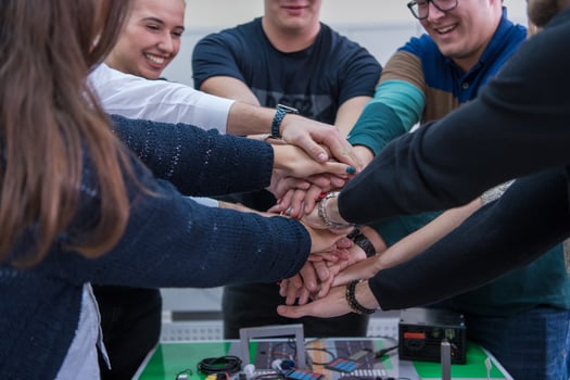 students celebrating successfully finished project photo