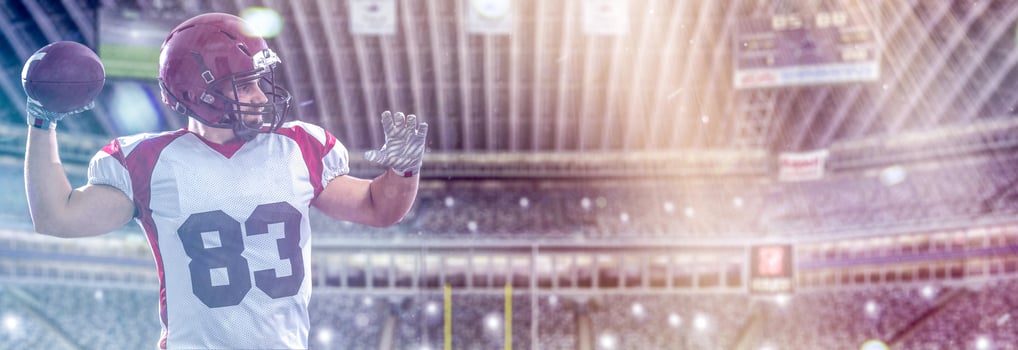 american football player throwing ball photo