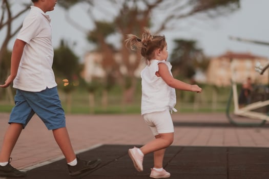 An elderly man in casual clothes with his daughter spends time together in the park on vacation. Family time. Selective focus photo