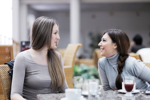 cute smiling women drinking a coffee photo