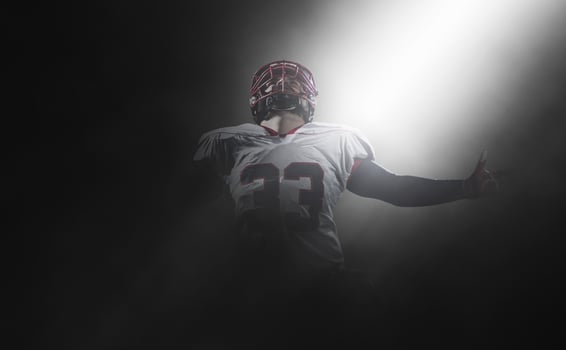 american football player celebrating after scoring a touchdown photo