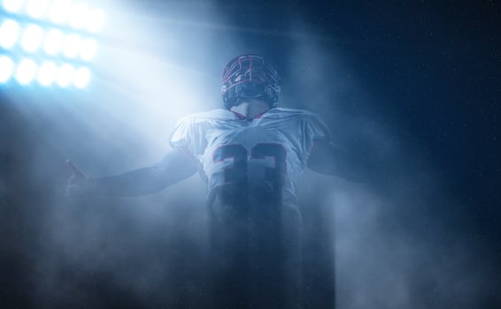 american football player celebrating after scoring a touchdown photo