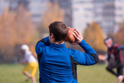 american football team with coach in action photo