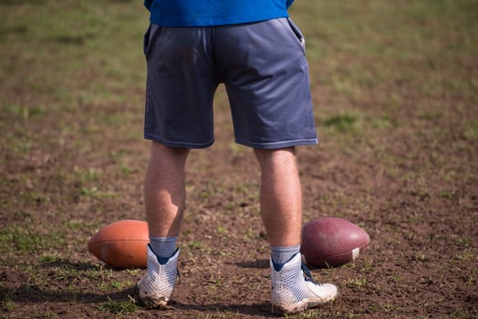 american football kicker practicing kickoff photo
