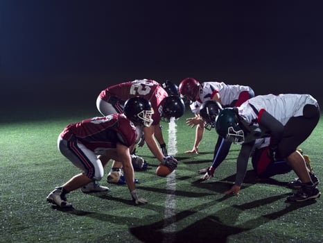 american football players are ready to start photo