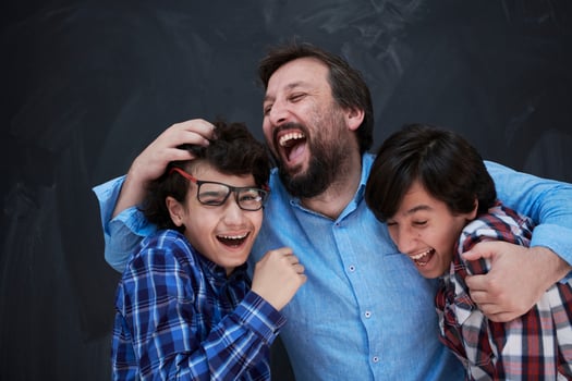 happy father hugging sons photo