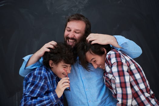 happy father hugging sons photo