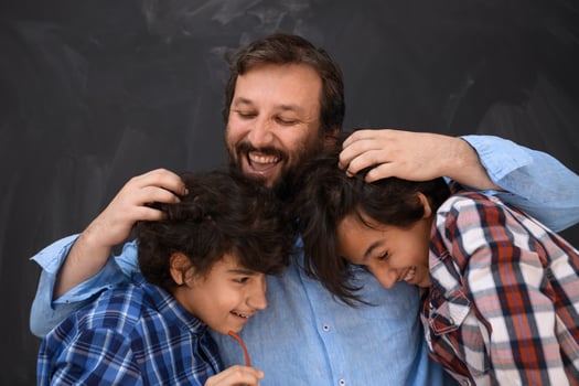 happy father hugging sons unforgetable moments of family joy in mixed race middle eastern arab family photo