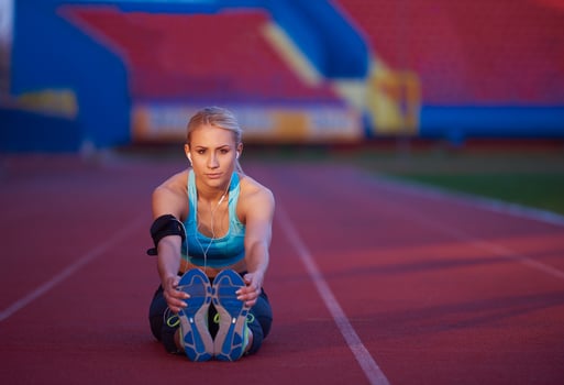 sporty woman on athletic race track photo