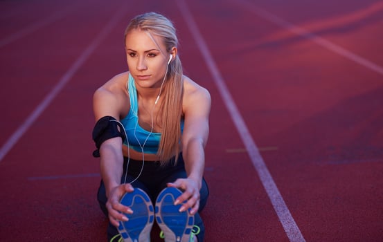 sporty woman on athletic race track photo