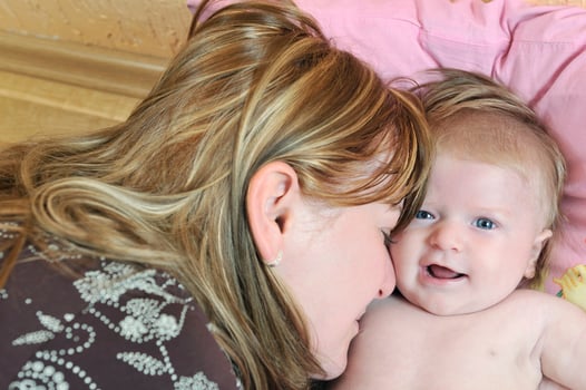 beautiful blonde young mother and cute baby photo