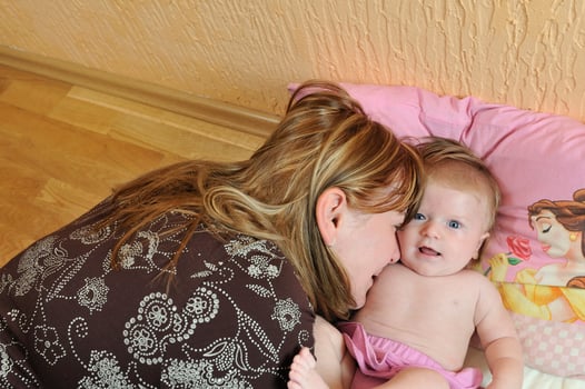 beautiful blonde young mother and cute baby photo