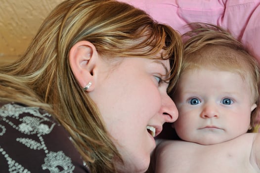 beautiful blonde young mother and cute baby photo