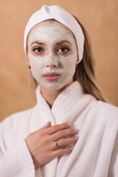 Spa Woman applying Facial Mask photo