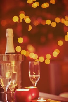 champagne and glasses at home on christmas night photo