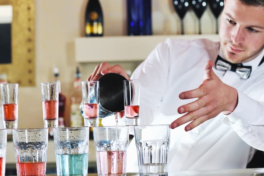 pro barman prepare coctail drink on party photo