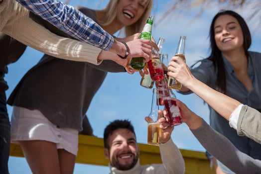 Group of friends having fun on autumn day at beach photo