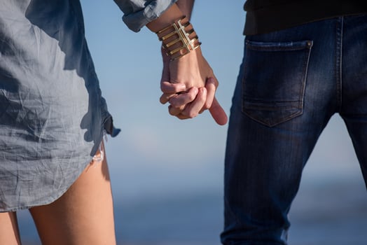 Loving young couple on a beach at autumn sunny day photo
