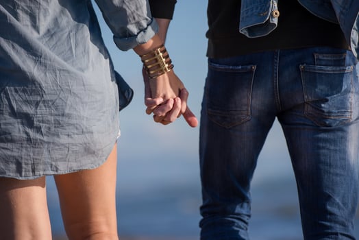 Loving young couple on a beach at autumn sunny day photo