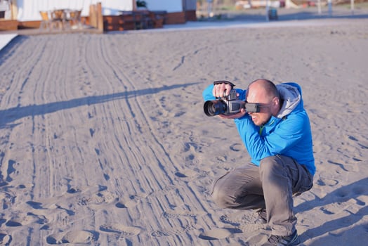 photographer taking photo on beach