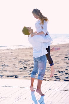 young couple  on beach have fun photo