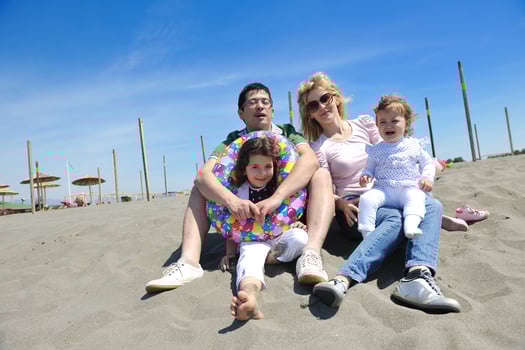 happy young family have fun on beach photo