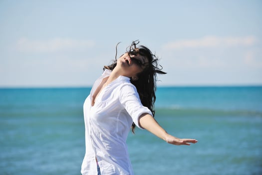 happy young woman on beach photo