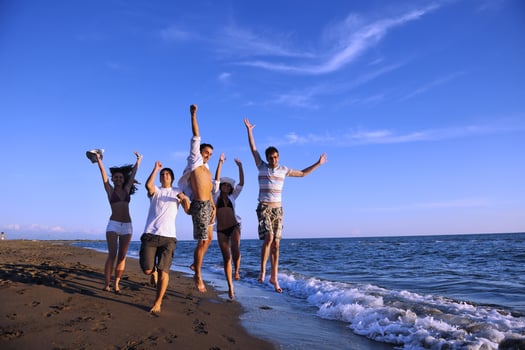people group running on the beach photo