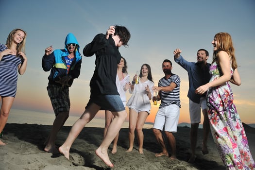 Group of young people enjoy summer  party at the beach photo