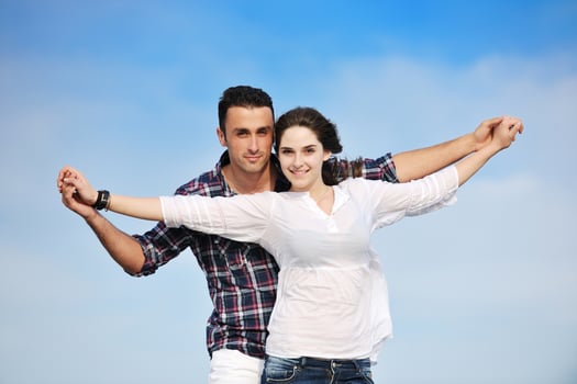 happy young couple have fun on beach photo