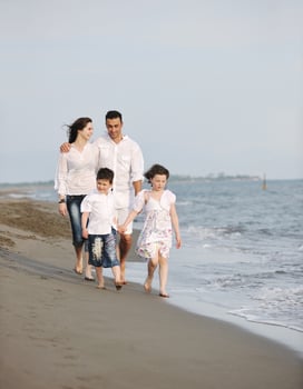 happy young family have fun on beach photo