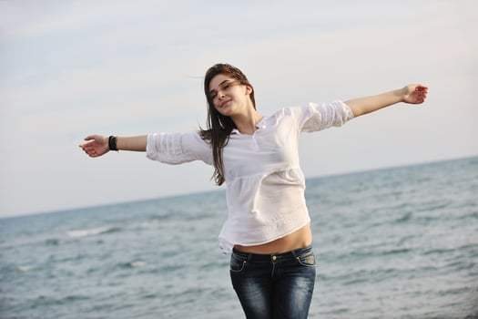 young woman enjoy on beach photo